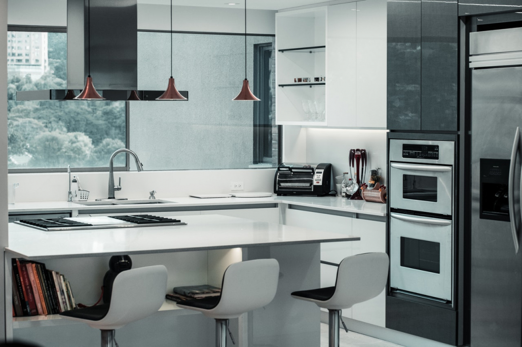 A modern black and white kitchen.