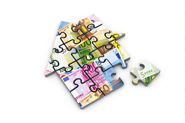 A puzzle in the shape of a house, with pictures of different banknotes on each of them