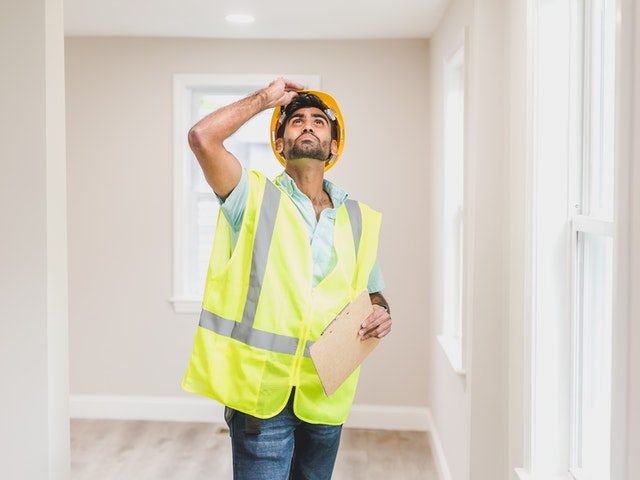 An inspector inspecting a house.