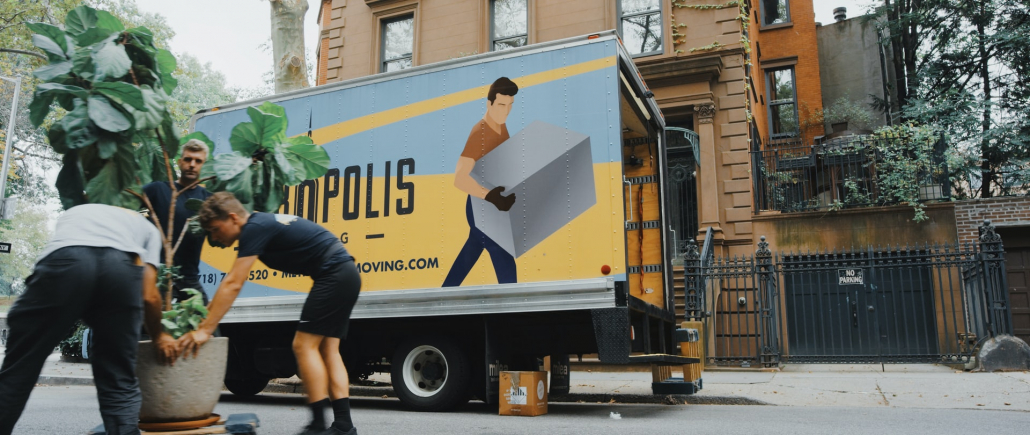 Mover loading a plant into a truck.