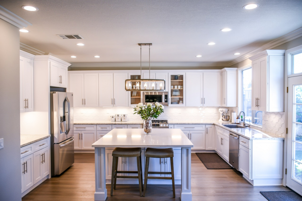 A beautiful and bright kitchen decorated with fresh flowers