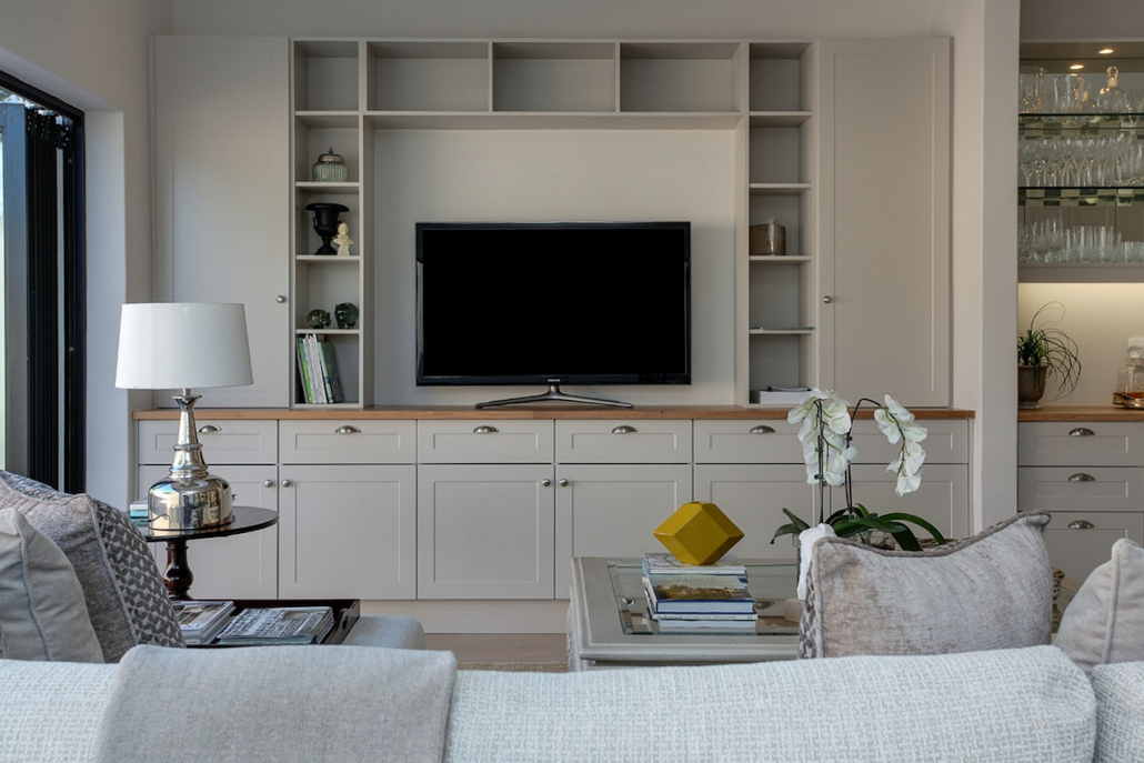 A living room with empty shelves