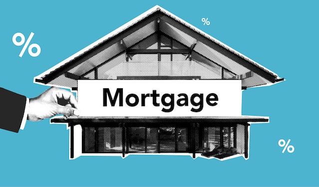 A house and a person’s hand holding a mortgage sign