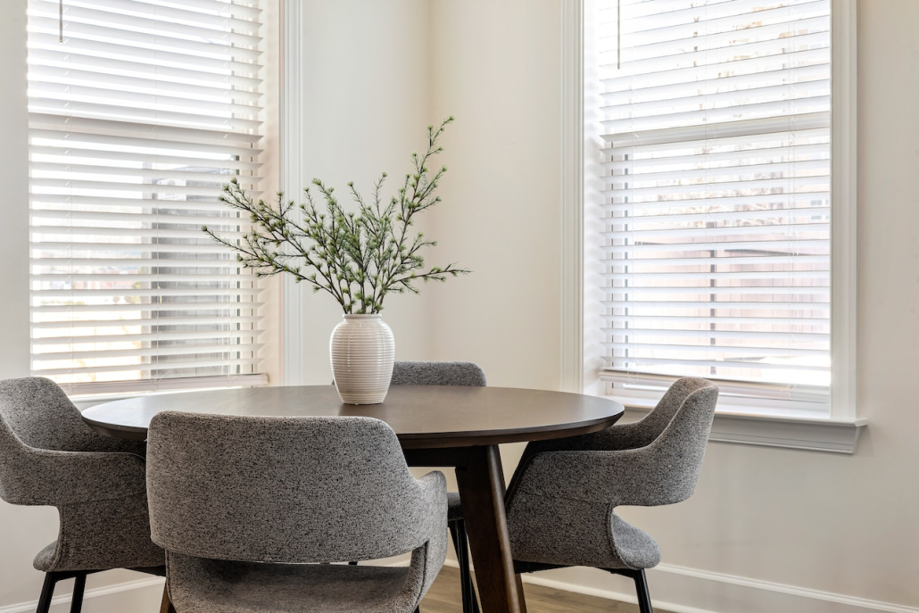 A small, minimalist dining room.