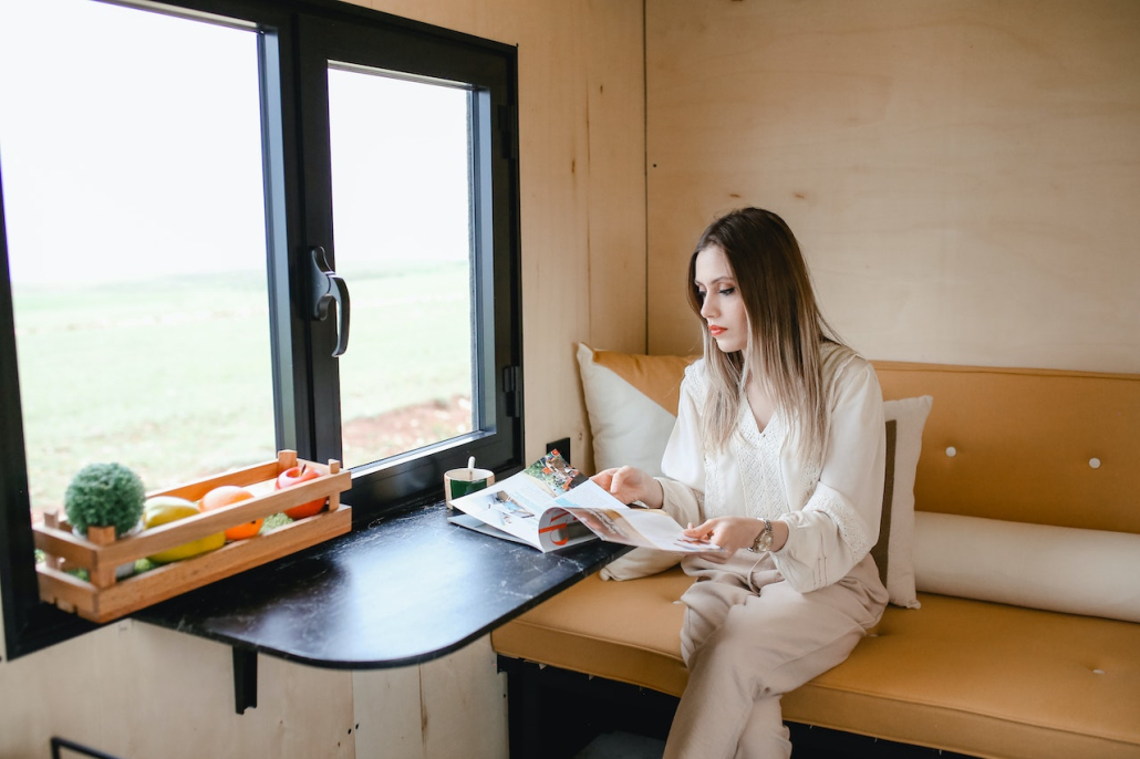 A woman reading at a small table.