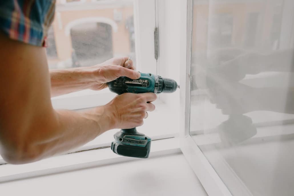 A man holding a drill during home improvement