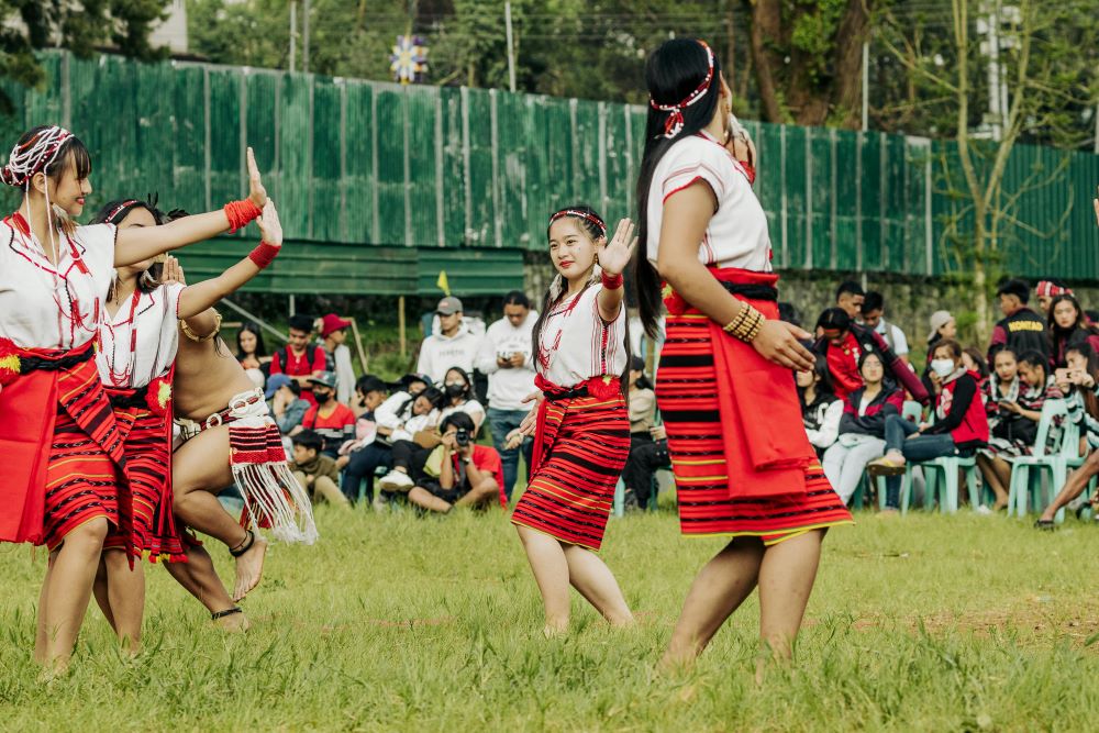 Native people celebrating their festival and dancing.Caption: Fully immersing yourself in New Zealand's unique lifestyle means embracing Kiwi culture wholeheartedly.